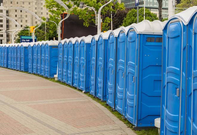 a row of portable restrooms at a fairground, offering visitors a clean and hassle-free experience in portola